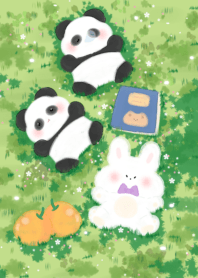 Panda sleeping on the grass