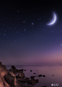 Calm sea and crescent moon