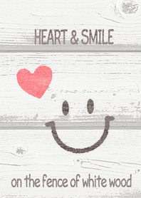 HEART & SMILE on the fence of white wood
