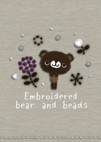 Embroidered bear and beads