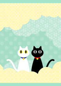 White cat and black cat on blue green