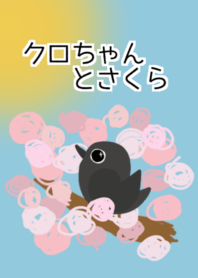 black bird perched on cherry blossom