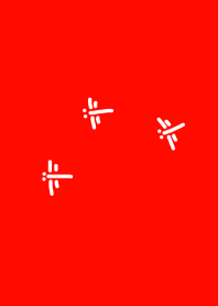 紅色の空に飛ぶトンボ