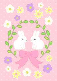 Lovely twin rabbits in the flower garden