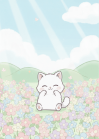 Cute white cat in flower field
