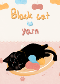 Black cat with yarn