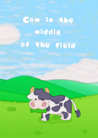 cow in the middle of the field