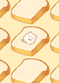 Fluffy little cat on the bread bed.