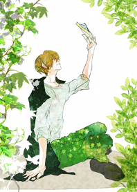 Young man reading a novel under green 2