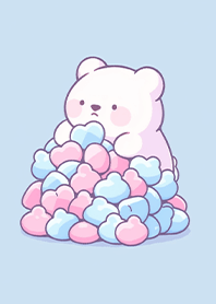 A small bear in a pile of marshmallows
