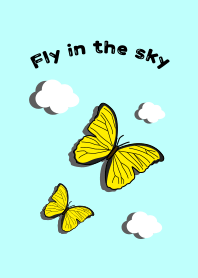 A yellow butterfly flying in the sky