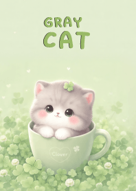 Cute Gray Cat In Green Clover
