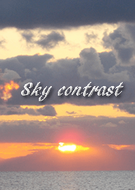 Contrast by sea, sky, clouds and sun