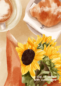 a cup of coffee with sunflowers