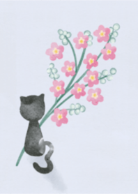 黒猫と赤い花