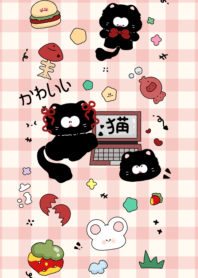 Black cat playing with laptop