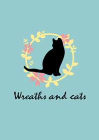 黒い猫と花輪
