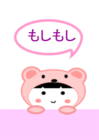 A little girl wearing a pink bear